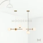 Luminaria Camila Gold con diseño minimalista en fondo blanco.