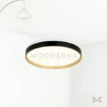 Luminaria Diane Black and Gold sobre fondo blanco, mostrando su diseño circular con acabado negro y borde dorado. Fabricada en aluminio y acrílico con luz LED integrada, combina elegancia y minimalismo en un solo diseño. Ideal para mostrar el producto de forma limpia y profesional en catálogos o páginas de producto.