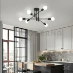 Lámpara Emma Black instalada en sala con tonos cálidos y decoración neutra.