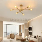 Lámpara Emma Gold en sala con paredes claras y decoración neutra.