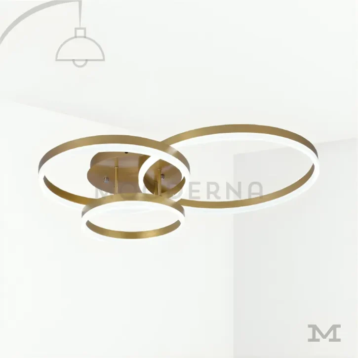 Luminaria Hermes Gold con fondo blanco.