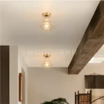 Instalación en corredor con luminaria Regina Gold Pass.