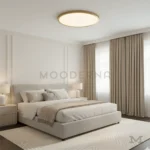 Luminaria Lizy Gold instalada en dormitorio moderno.