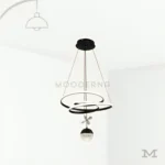 Luminaria Madie Black colgante con diseño moderno sobre fondo blanco.