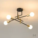 Detalle cercano de la luminaria Eleanor Black and Gold mostrando acabados