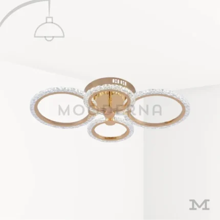 Luminaria Dasha Gold sobre fondo blanco con diseño circular moderno y acabado dorado mate. Su estructura combina elegancia y funcionalidad, fabricada en aluminio con luz LED integrada que proporciona una iluminación uniforme y cálida para todo tipo de espacios.