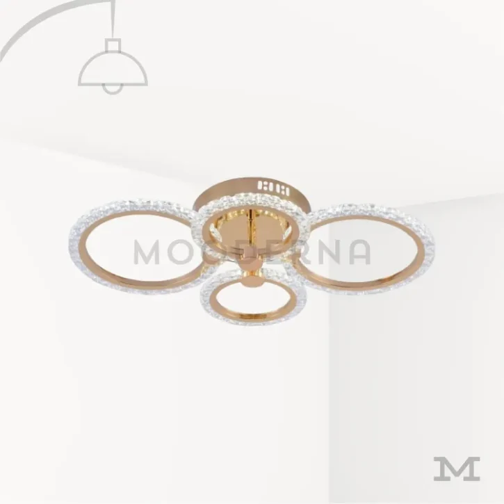 Luminaria Dasha Gold sobre fondo blanco con diseño circular moderno y acabado dorado mate. Su estructura combina elegancia y funcionalidad, fabricada en aluminio con luz LED integrada que proporciona una iluminación uniforme y cálida para todo tipo de espacios.
