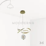 Luminaria Calix Gold sobre fondo blanco con diseño moderno en forma de cinta dorada suspendida. Fabricada en aluminio y acrílico con luz LED integrada, combina elegancia y estilo contemporáneo, ideal para iluminar y decorar espacios sofisticados del hogar.