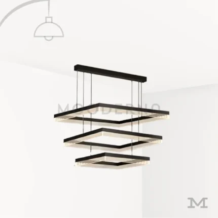 Luminaria Amelie Black sobre fondo blanco con diseño geométrico de tres niveles cuadrados suspendidos. Fabricada en aluminio y acrílico con luz LED integrada, combina elegancia y modernidad, ideal para ambientes amplios y contemporáneos.