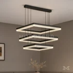 Luminaria Amelie Black en vista lateral instalada en comedor. Su estructura flotante de líneas negras crea un equilibrio perfecto entre diseño y funcionalidad, ideal para interiores con estilo arquitectónico o contemporáneo.