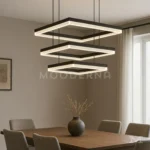 Luminaria Amelie Black instalada sobre comedor elegante. Su diseño suspendido crea un efecto visual impresionante con líneas limpias y luz uniforme. Perfecta para iluminar mesas amplias y resaltar la decoración moderna del espacio.