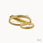 Luminaria Annelie Gold mostrando sus dimensiones reales de 50 cm y 35 cm en cada aro. Su estructura de aluminio y vidrio con LED integrado ofrece iluminación uniforme y estética sofisticada.