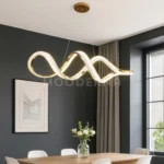 Luminaria Vittora Gold instalada en comedor con decoración minimalista. Su luz LED ajustable en tres tonos (blanco, cálido y neutro) permite adaptar el ambiente según el momento del día, aportando versatilidad y estilo.