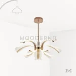 Luminaria Thea Gold sobre fondo blanco con diseño elegante de brazos curvos y acabado dorado satinado. Fabricada en aluminio y acrílico con luz LED integrada, combina estilo clásico y moderno, ideal para realzar comedores o salas con decoración sofisticada.