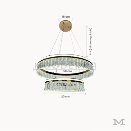 Luminaria Deline Gold con medidas visibles. Presenta aros de 50 y 30 cm de diámetro con altura regulable hasta 1 metro. Su estructura metálica dorada y forma geométrica permiten planificar fácilmente su instalación en comedores amplios o salas modernas.