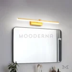 Luminaria Sigrid Gold montada en un baño con diseño contemporáneo, ofreciendo iluminación suave que realza los detalles del ambiente.