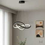 Fiore Black iluminando sala contemporánea, destacando su diseño limpio y su capacidad de integrarse con ambientes de tonos neutros y estilo moderno.