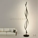 Livana Black en una tercera ambientación de sala, funcionando como punto focal decorativo que combina iluminación funcional con un diseño artístico de alto impacto visual.