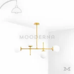 Sabina Gold en fondo blanco, mostrando su estructura metálica en acabado dorado satinado combinada con esferas de vidrio que aportan un estilo elegante y contemporáneo.