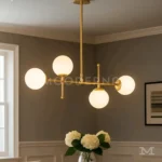 Sabina Gold instalada en comedor, aportando iluminación uniforme y una estética sofisticada que complementa mesas de comedor y áreas sociales.