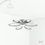 Loto Platinum en fondo blanco mostrando su diseño moderno de formas orgánicas tipo pétalos, con acabado cromado que refleja la luz y aporta un estilo elegante y contemporáneo al espacio.