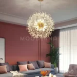 Ela Luz Gold instalada en sala moderna, aportando un brillo cálido y efecto visual tipo estrella que transforma el ambiente en un espacio sofisticado y acogedor.