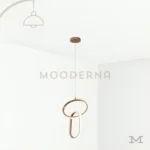 Lorea One Gold en fondo blanco mostrando su diseño moderno de líneas curvas y estructura delicada en acabado dorado satinado, ideal para espacios que buscan elegancia sutil sin sobrecargar el ambiente.