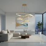 Imperial Gold instalada en sala de doble altura, creando un punto focal imponente gracias a su caída vertical y anillos LED suspendidos.