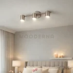 Noeimira Plata en sala, destacando su acabado plateado y orientación ajustable.