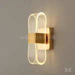 Angelina Gold instalada en habitación, aportando iluminación cálida y ambiente acogedor.