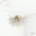 Venus Gold en fondo blanco, resaltando su diseño escultórico con múltiples brazos en acabado dorado y luz LED integrada.