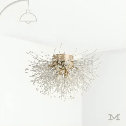 Venus Gold en fondo blanco, resaltando su diseño escultórico con múltiples brazos en acabado dorado y luz LED integrada.