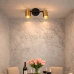 Aronia Black and Gold en sala, destacando la orientación ajustable de sus focos.