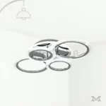 Dasha Platinum en fondo blanco, mostrando su diseño circular moderno con acabado cromado y aros LED integrados.