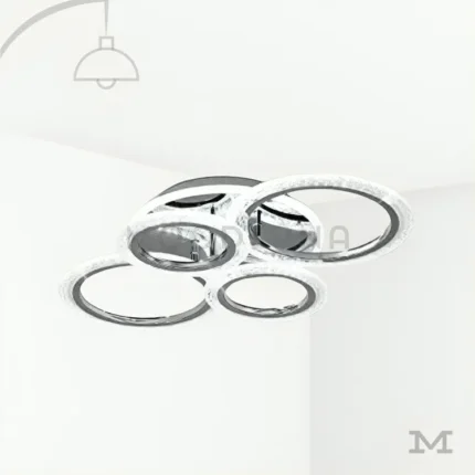 Dasha Platinum en fondo blanco, mostrando su diseño circular moderno con acabado cromado y aros LED integrados.