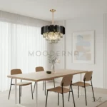 Tokio Black and Gold instalada sobre comedor moderno, aportando iluminación focal y un toque de lujo al espacio.