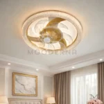 Yvonne Gold instalada en habitación, aportando iluminación cálida y ventilación silenciosa.