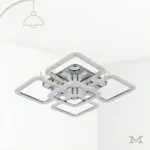 Carmina Gold en fondo blanco, resaltando su diseño geométrico moderno en acabado dorado satinado.