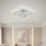 Carmina Gold instalada en sala, aportando iluminación potente y uniforme.