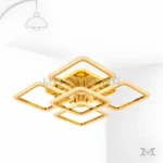 Carmina Gold en fondo blanco, resaltando su diseño geométrico moderno en acabado dorado satinado.