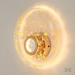 Detalle cercano de Signe Gold, mostrando el acabado satinado y difusor acrílico.