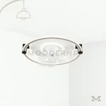 Annika en fondo blanco, resaltando su diseño circular moderno con acabado mate y luz LED integrada.