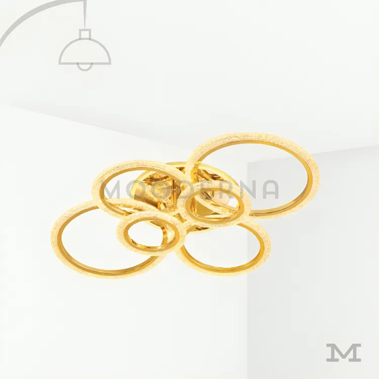Luminaria de techo LED decorativa. Tyra Gold en fondo blanco, destacando su diseño moderno con aros entrelazados y acabado dorado satinado.