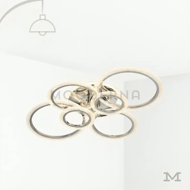 Tyra Platinum en fondo blanco, destacando su diseño moderno con aros entrelazados en acabado platino satinado.