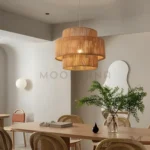 Arvid en comedor, resaltando la mesa central con luz envolvente.