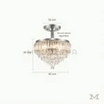 Pauline Plata Crystal con medidas referenciales, mostrando su diámetro de 40 cm y altura regulable.