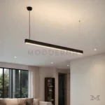 Ofelia Black en isla de cocina desde otro ángulo, resaltando su diseño moderno y luz continua.