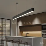 Ofelia Black instalada sobre isla de cocina, iluminando de forma uniforme toda la superficie.