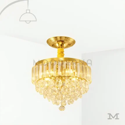 Pauline Gold Crystal en fondo blanco, destacando su diseño elegante con cristales decorativos y acabado dorado brillante.