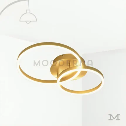 Katianna Gold en fondo blanco, destacando su diseño moderno con doble aro LED en acabado dorado elegante.
